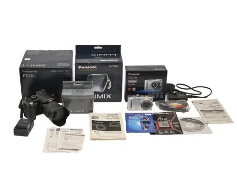 Digital photography. A Panasonic Lumix VNC-SZ30 camera, black, maker's battery charger, leather case and boxes and a Lumix TZ