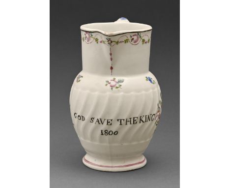 An early Coalport jug, dated 1800, enameled in polychrome with flowers and inscribed in black GOD SAVE THE KING 1800, 15cm h 