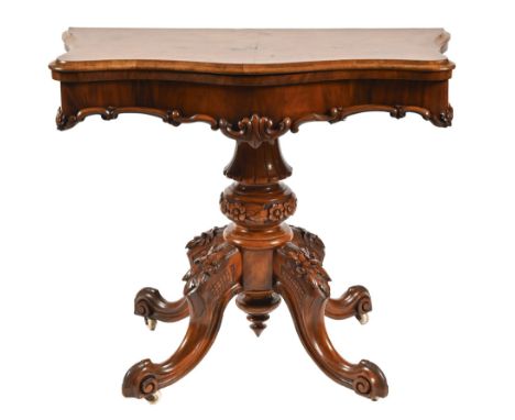 A Victorian walnut card table, on carved pedestal base and four scrolling legs with pottery castors, 77cm h, 92cm w 