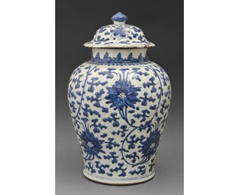 A Chinese blue and white vase and cover, Kangxi period, painted with lotus meander, 40cm h  With extensive cracks from point 