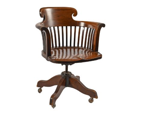 An walnut swivel chair, early 20th c, with paddle seat and cast iron action, 86cm h, including later Shepherd castors  Pleasi