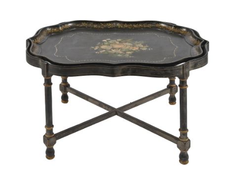A Victorian papier mache tea tray, inlaid in mother-of-pearl and painted and gilt with flowers, 58 x79cm, on ebonised and woo