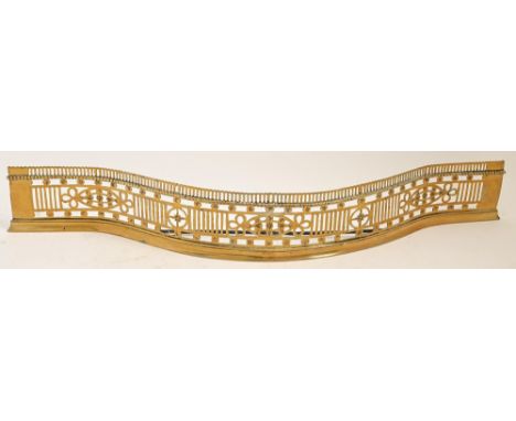 A Victorian pierced brass serpentine fender, 111cm l 