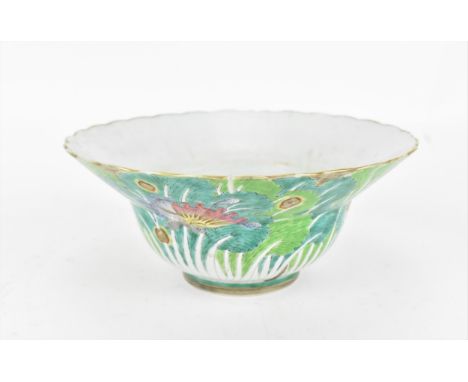 A Chinese Qing dynasty porcelain flared bowl, Jiaqing period (1796-1820), with polychrome enamel exterior with vegetation and