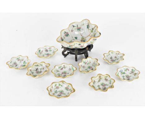 A set of Chinese Qing dynasty porcelain leaf dishes, with enamel crickets and flowers, and gold rim, comprising nine small di