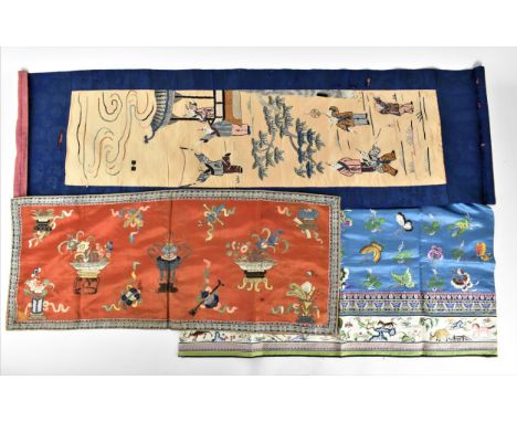 Three Chinese Qing dynasty embroidered silks, late 19th/early 20th century, comprising a hanging scroll style embroidery with