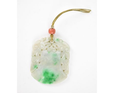 A Chinese carved jade pendant in the form of a bell or archaic vessel with pierced foliage detail, on a string suspension wit