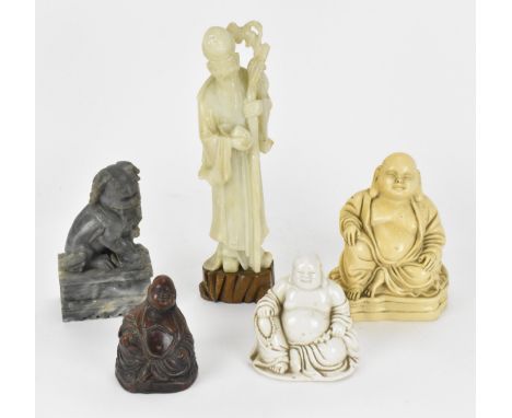 A group of Oriental laughing Buddhas, comprising a dehua model, a carved wooden model and a resin one, together with an opaqu