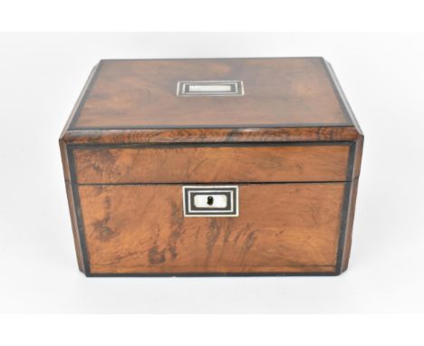 A Victorian mother-of-pearl inlaid travel vanity box, the top with cavetto border with ebonised thick stringing, opening to a