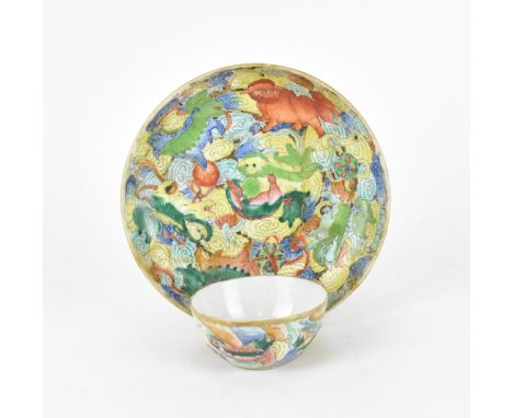A Chinese late Qing dynasty famille rose Buddhist lions bowl, 19th century, the lions playing with brocade balls, with gilt d