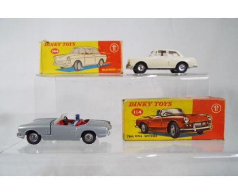 Dinky Toys - # 114 Triumph Spitfire, silver/grey coloured with red interior, seat belt, windscreen and driver with opening bo