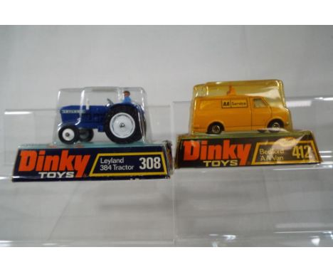 Dinky Toys - Leyland 384 Tractor # 308. Dark blue body with white hubs and blue driver. Appears mint in original bubble packa