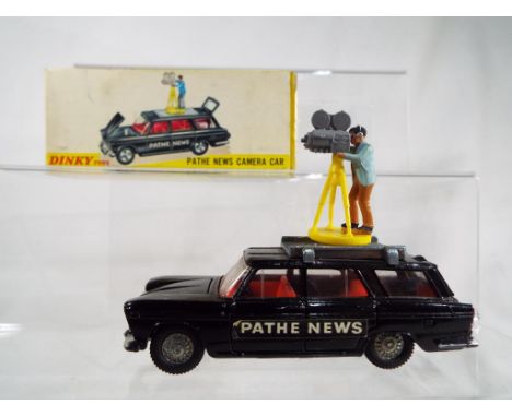 Dinky Toys - Pathe News Camera Car, black body, red interior, cast wheels, cameraman brown trousers, camera and stand, #281 e