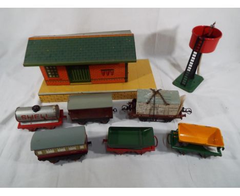 Model Railways - A good lot to include a large quantity of 0 gauge model railway toys to include a Hornby clockwork train set