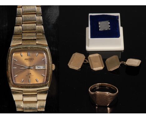 A pair of 9ct gold canted rectangular cufflinks, plain central platform within engine turned border;  a 9ct gold signet ring;