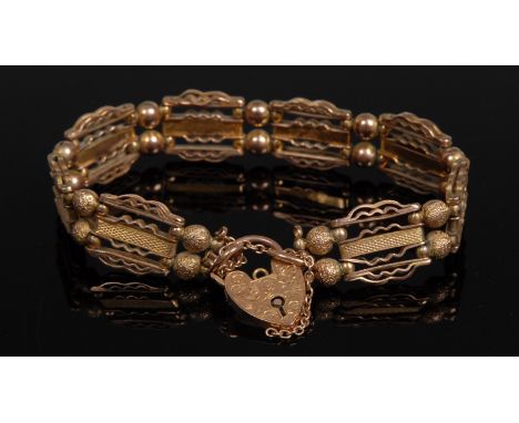 A 9ct gold fancy link gate bracelet, padlock clasp, 16cm long, 19g
