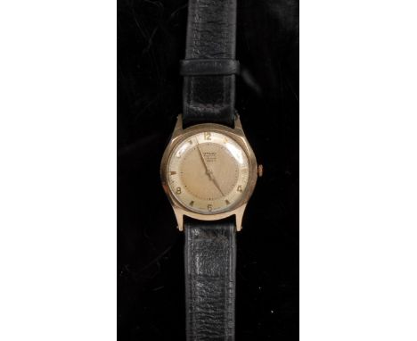 Rotary - a 1950s gentleman's Incabloc 9ct gold cased wrist watch, textured two tone dial, sun burst outer ring, alternating A