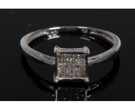 A twenty five stone diamond checker board ring, set in five rows of five, raised collar, 14ct white gold shank, size N, 1.3g 