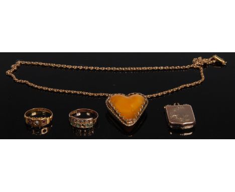 A yellow metal mounted amber heart pendant; a fancy link 9ct gold chain;'  a ruby and seed pearl three stone ring, 15ct gold 