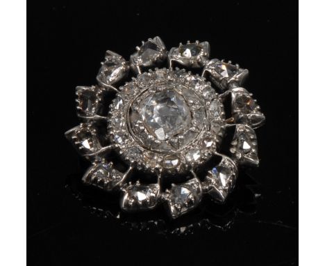 A diamond encrusted open work circular brooch, central cushion cut diamond approx 0.87ct, rub over set, within a ring of sixt
