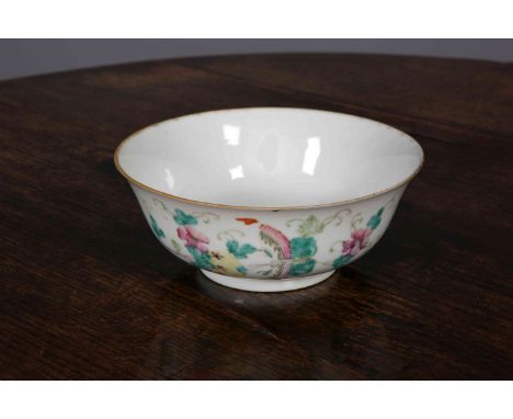 A CHINESE PORCELAIN BOWL, enamel painted with bats, butterflies and foliage, iron red seal mark. 17cm wide