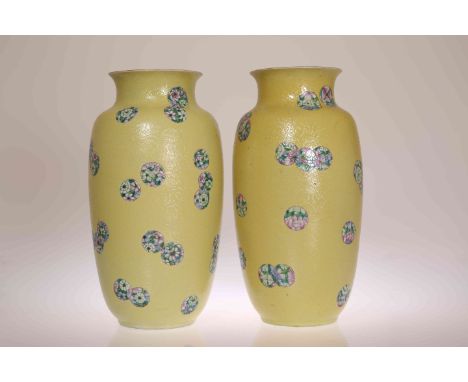 A PAIR OF CHINESE YELLOW SGRAFFITO GROUND VASES, LATE 19TH/EARLY 20TH CENTURY, each decorated with scattered medallions fille