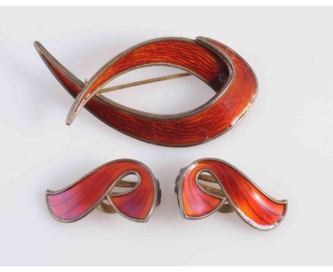 A SILVER AND ENAMEL BROOCH BY O.J HJORTDAHL, the curved design mount set throughout with dark red guilloche enamelling on bro