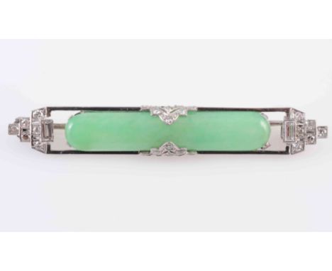 A JADEITE AND DIAMOND BROOCH, the oval jadeite plaque set throughout with twenty eight graduating old brilliant cut diamond h