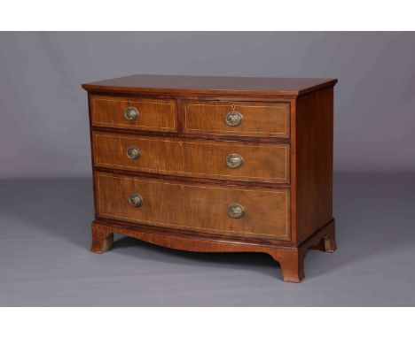 AN EDWARDIAN FADED SATINWOOD BOW-FRONTED CHEST OF DRAWERS, WARING & GILLOW, fitted with two short over two long string inlaid