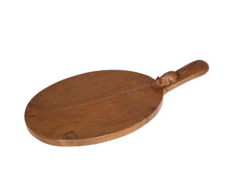 ROBERT THOMPSON OF KILBURNA MOUSEMAN OAK CHEESEBOARD, of typical shape with carved mouse signature to the handle. 40cm