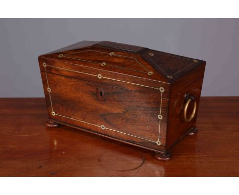 AN EARLY 19TH CENTURY MOTHER-OF-PEARL INLAID ROSEWOOD TEA CADDY, with brass ring handles and flattened bun feet. 18cm by 33cm