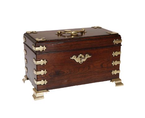 A GEORGE III PADOUK AND BRASS MOUNTED TEA CADDY, POSSIBLY BY JOHN CHANNON, with moulded cover and brass strap mounts, the int