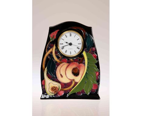 A MOORCROFT "QUEENS CHOICE" MANTEL CLOCK, first quality. 21cm