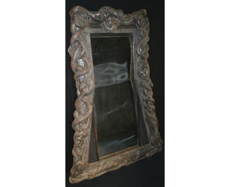 Props - a large mirror, the frame modelled with snakes, 196cm high, 140cm wide