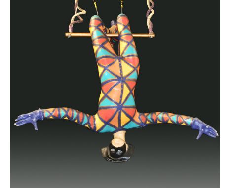 Props - a large hanging trapeze figure, brightly coloured harlequin costume, 240cm wide
