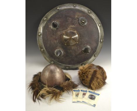 King Arthur - Props - Sir Dagonet's shield, 64cm diam; two Anglo-Saxon helmets (3)