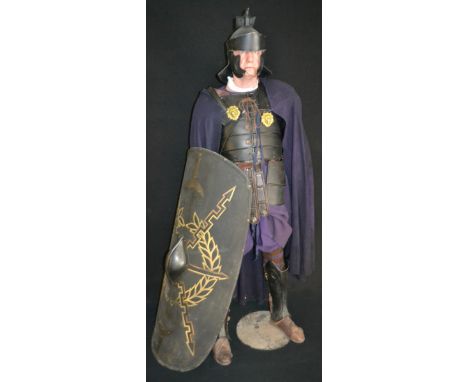 Gladiator - a Praetorian Guard costume, with dark blue cloak, black helmet with eagle crest and black shield, 196cm high