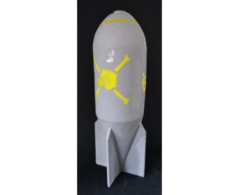 Props - a bomb, painted in yellow with cross-bones symbol, 107cm high