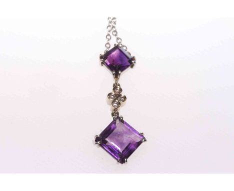 Diamond and amethyst pendant on round link chain.
