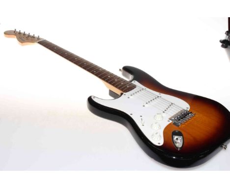 Guitar marked Squier by Fender, and gig bag.