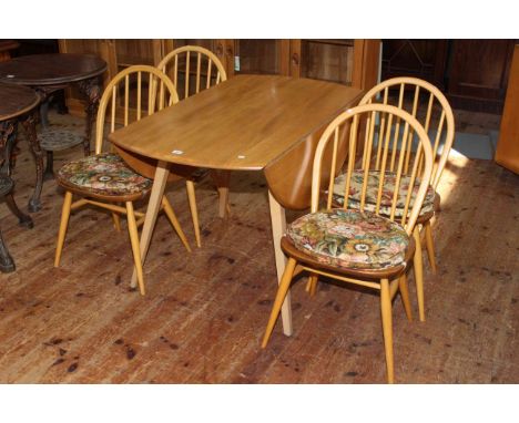 Ercol Windsor six piece dining suite comprising three door sideboard, drop leaf table and four Quaker dining chairs.