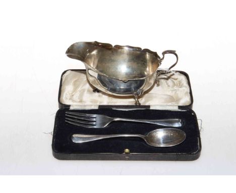 Reid and Sons, Newcastle, silver sauce boat, London 1916 and a silver spoon and fork in box, Sheffield 1938 and 1939.