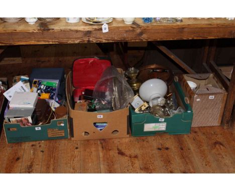 Four boxes of cameras and accessories, costume jewellery, oil lamp and metalware, tea set, etc.