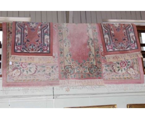 Pink ground Chinese carpet 3.20 by 2.20, pink ground Chinese runner 3.05 by 0.70 and pair pink ground Chinese rugs 1.25 by 0.