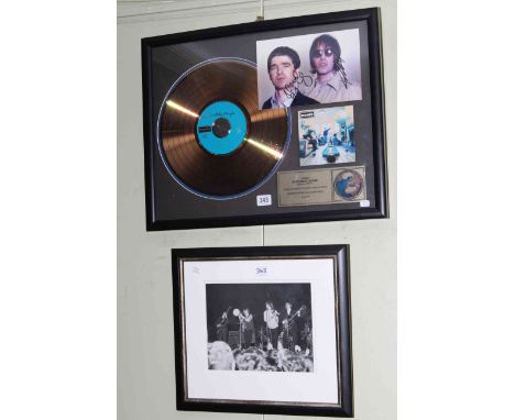 Framed Oasis 'Definitely Maybe' disc and photograph, limited edition 31 of 500 and framed Rolling Stones photograph (2).