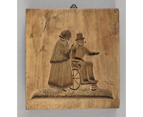 Kleiner hölzerner Model. Dame schiebt im Rollstuhl sitzenden Herrn. 19. Jh. 11 x 10 cm