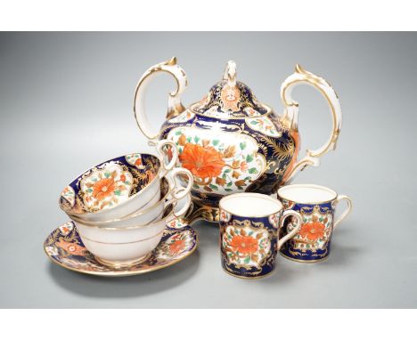 A mid 19th century English bone china fifty-two piece part tea and coffee service, decorated in an Imari pattern