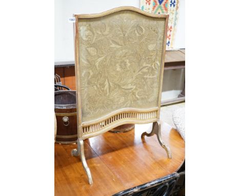 A carved gilt wood fire screen with internal needlework panel, width 56cm, height 92cm