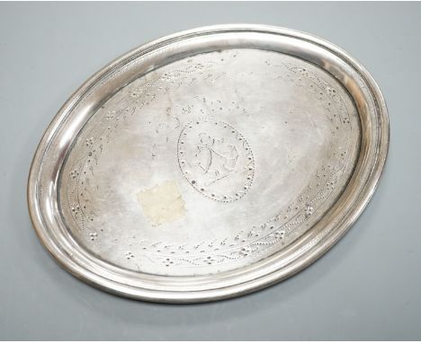 A George III silver oval teapot stand, with tired engraved decoration and wooden base, London, 1790, marks quite rubbed, 16.9