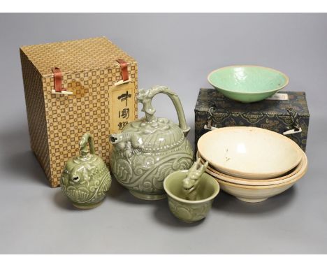 A group of Chinese celadon vessels and Qingbai type bowls, teapot 17 cms high.